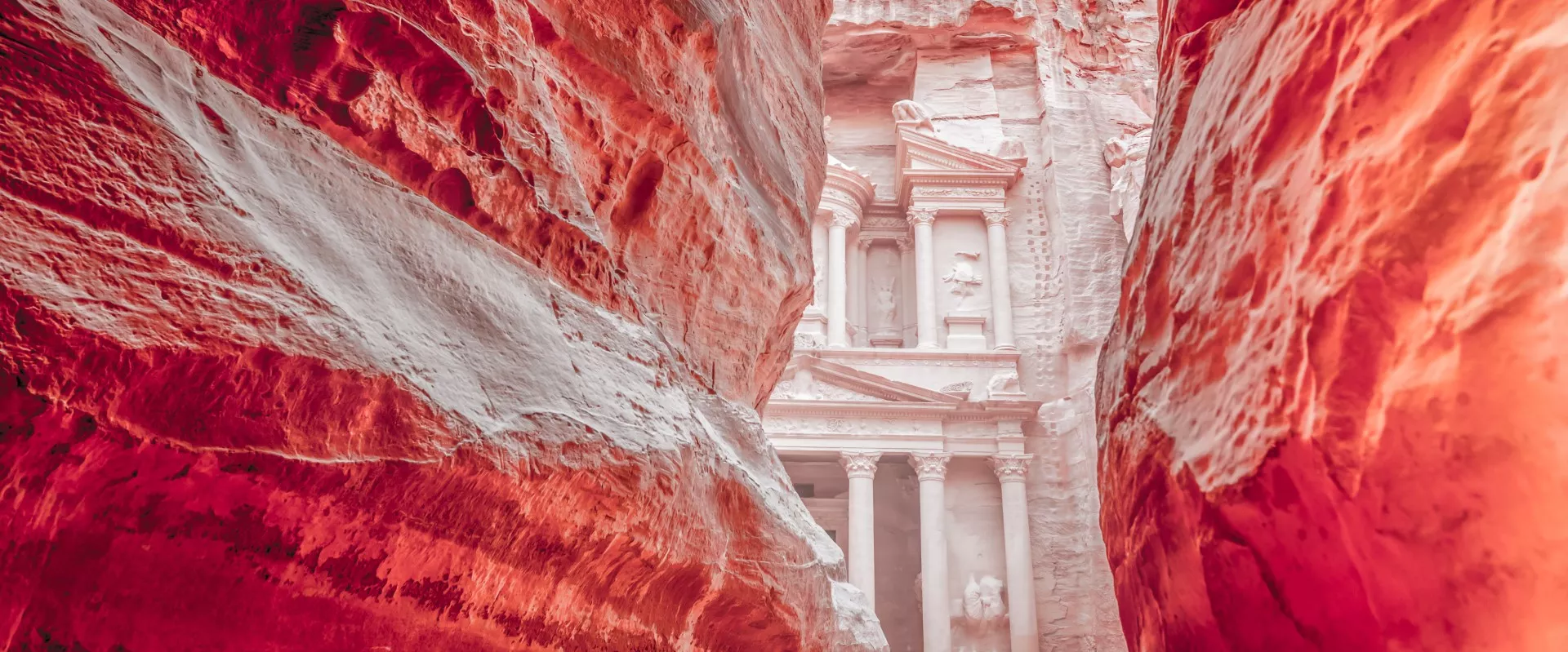 The carved facade of the Monastery Ad Deir high above Petra Jordan