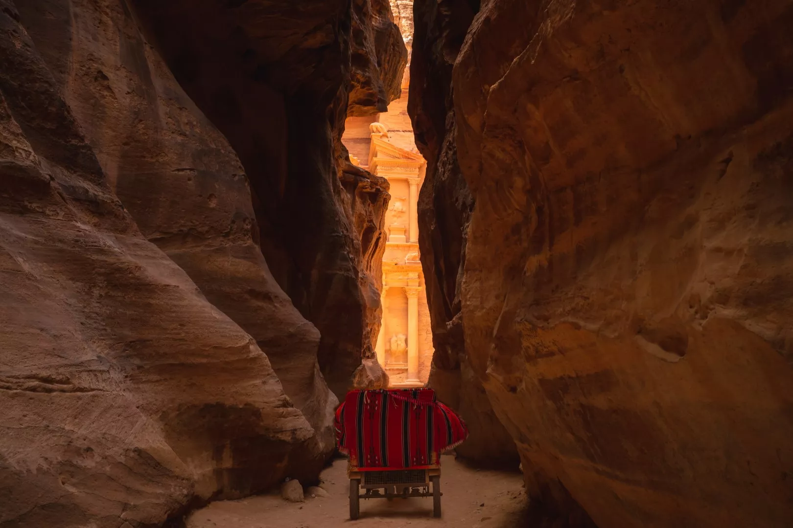 Carved facades in the narrow canyon of Little Petra Siq al-Barid